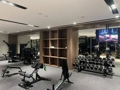 a gym with exercise equipment and a tv in it at NEW YEARS Luxury Burj Khalifa and Fountain Views in Dubai