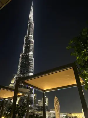 a view of the tallest building in the world at night at NEW YEARS Luxury Burj Khalifa and Fountain Views in Dubai