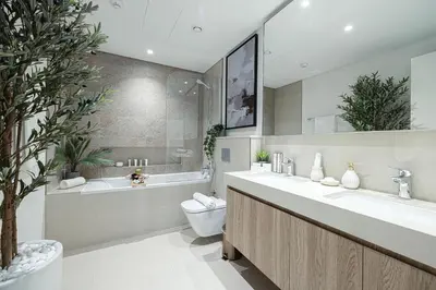 a bathroom with a sink and a toilet and a tub at Elite 4 Bedroom Luxury Apartment, Burj Khalifa View, Opposite Dubai Mall, Infinity Swimming Pool in Dubai
