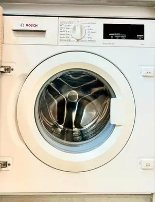 a close up of a white washing machine at Azizi Mina - Palm Jumeirah in Dubai