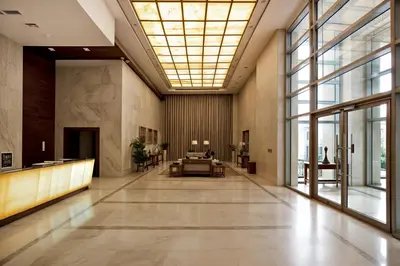 a lobby of a building with a large window at Modern Stylish Studio Apartment next to Burj Khalifa walk into Dubai mall in Dubai
