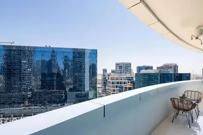 a balcony with a view of a city at Frank Porter - Damac Distinction in Dubai