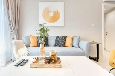 a living room with a couch and a table at HAVN - NEW 1 Bedroom Apartment in Business Bay in Dubai
