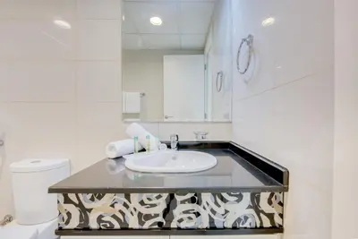 a bathroom with a sink and a toilet at HAVN - NEW 1 Bedroom Apartment in Business Bay in Dubai