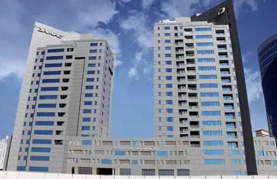 two tall buildings in a city with the sky at HAVN - NEW 1 Bedroom Apartment in Business Bay in Dubai