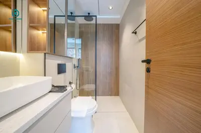a bathroom with a toilet and a sink and a shower at Blue Breeze - Chic & Cozy 1 BR Getaway in Al Furjan in Dubai