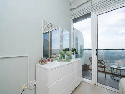 a bathroom with a sink and a window at Elegant Studio in Bloom JVC with High-End Finishes in Dubai