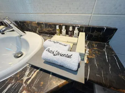 a bathroom counter with a box on a sink at Holiday Homes by DO- The Zumrud in Dubai