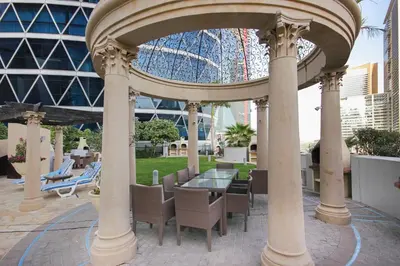 a gazebo with a table and chairs and a roller coaster at GuestReady - Upscale living near Downtown Dubai in Dubai