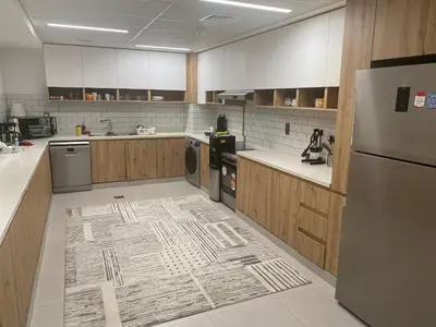 a large kitchen with a rug on the floor at 2Bedroom Apartment for Rent Fully Furnished ,Spacious in Dubai