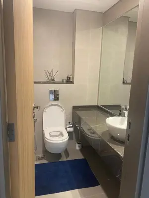 a bathroom with a toilet and a sink at 2Bedroom Apartment for Rent Fully Furnished ,Spacious in Dubai