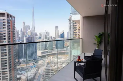 a balcony with a view of a city at Relax in Style with Outdoor Pool and Burj Khalifa Views Nearby in Dubai