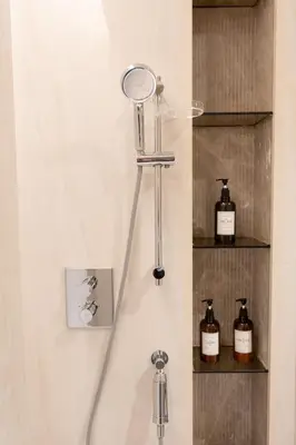 a towel rack with a mirror in a bathroom at Relax in Style with Outdoor Pool and Burj Khalifa Views Nearby in Dubai