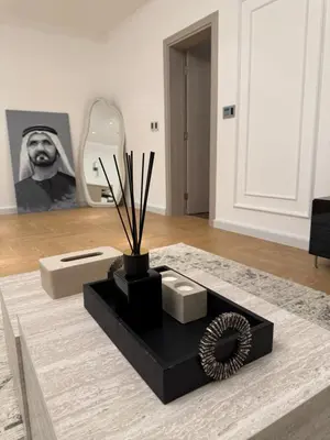 a living room with a black table and a mirror at TYS EXCELLENCE luxury apartment Palm Jumeirah DUBAI in Dubai