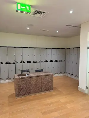 a dressing room with lockers and a desk in it at TYS EXCELLENCE luxury apartment Palm Jumeirah DUBAI in Dubai