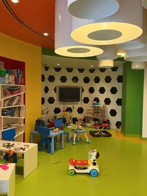 a room filled with toys and a tv on a wall at TYS EXCELLENCE luxury apartment Palm Jumeirah DUBAI in Dubai