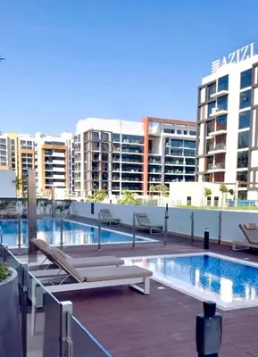 a pool on the roof of a building at Burj Khalifa View studio in Dubai