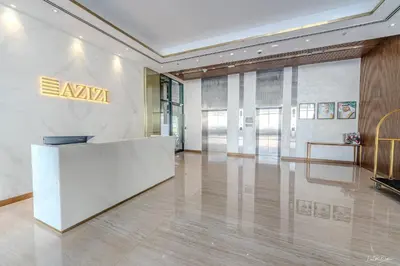a lobby with aania sign on the wall in a building at Burj Khalifa View studio in Dubai