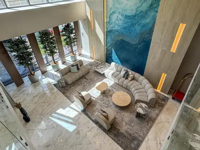 an overhead view of a living room with couches and tables at Dubai Marina View - 2BR APT with Pool & Gym in Dubai