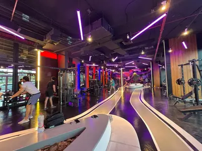 a bowling alley with people playing a game at Cozy Studio Apartment Holiday Home l Perfect for Couples in Dubai