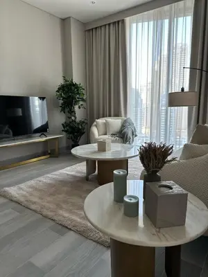 a living room with a couch and a tv at Entire apartment in Dubai Marina in Dubai