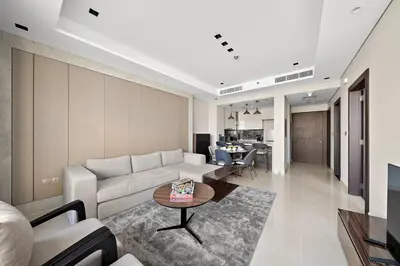 a living room with a couch and a table at FIRST CLASS 1BR Elegant Modern Retreat in Dubai