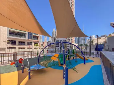 a playground on the roof of a building at Frank Porter - Peninsula Five in Dubai