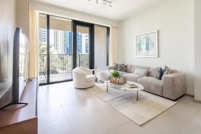 a living room with a couch and a table at Frank Porter - Boulevard Heights in Dubai