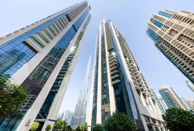 a view of two tall buildings in a city at Luxury Apartment with Burj Khalifa Views - 5-Min Walk to Dubai Mall - Newly Upgraded - 10 people - Near Dubai Opera in Dubai