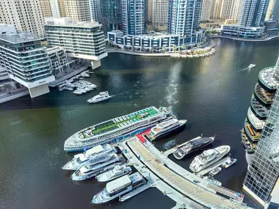 a group of boats docked in a harbor in a city at Nomad Retreats- Silverene tower Marina view in Dubai