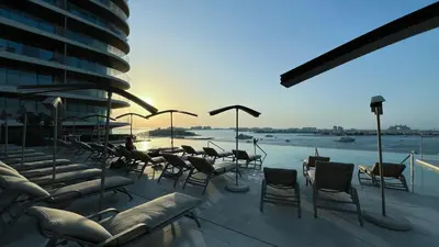 a group of chairs and tables on a building at Fendi 1BR with Panoramic Sea View in Dubai