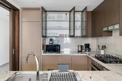 a kitchen with a sink and a counter at Silkhaus Serene 1BR at Boulevard Heights in Downtown in Dubai