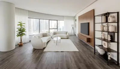 a living room with a couch and a tv at Beautiful 3 bed In Dubai Marina! in Dubai