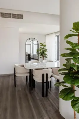a dining room with a table and chairs at Beautiful 3 bed In Dubai Marina! in Dubai