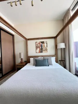 a bedroom with a large white bed in a room at Modern & Smart 1br W Stylish Interiors In Jvc in Dubai