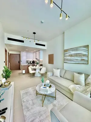 a living room with a couch and a table at Bright & Modern 1br In Jvc Pool Free Parking in Dubai