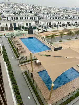 an overhead view of a swimming pool in a building at Dubai - Brand New Apartment in Dubai