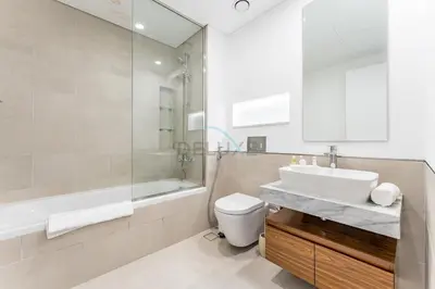 a bathroom with a sink and a tub and a toilet at 2BR with Balcony, Exclusive Amenities and Steps from Iconic Landmarks, Madinat Jumeirah Living Rahaal 2, Jumeirah in Dubai