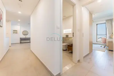 a view of the living room from the hallway of an apartment at 2BR with Balcony, Exclusive Amenities and Steps from Iconic Landmarks, Madinat Jumeirah Living Rahaal 2, Jumeirah in Dubai
