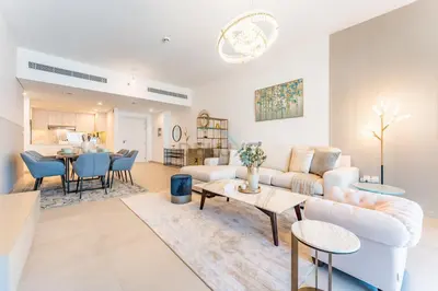 a living room with a couch and a table at 2BR with Balcony, Exclusive Amenities and Steps from Iconic Landmarks, Madinat Jumeirah Living Rahaal 2, Jumeirah in Dubai