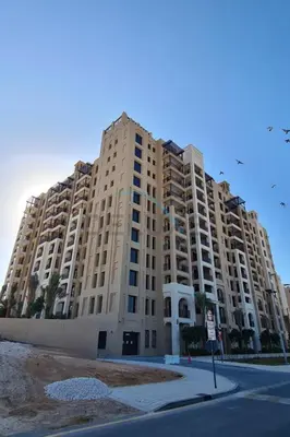 a large apartment building on the side of a street at 2BR with Balcony, Exclusive Amenities and Steps from Iconic Landmarks, Madinat Jumeirah Living Rahaal 2, Jumeirah in Dubai