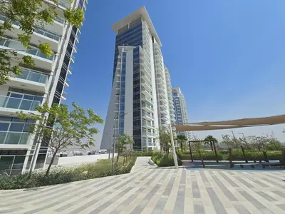 a view of two tall buildings in a city at EasyGo- Sleek Studio at Damac Hills Artesia D in Dubai