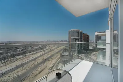 a view of the beach from a balcony of a building at EasyGo- Sleek Studio at Damac Hills Artesia D in Dubai