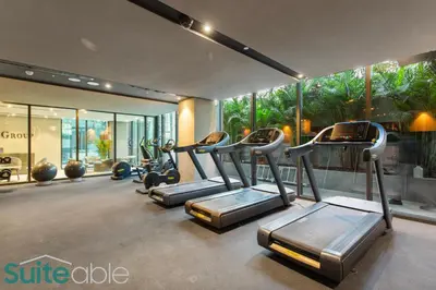 a gym with cardio equipment in a building at Vibrant & Exclusive Pool View Studio in Autograph in Dubai
