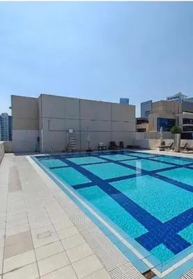a large swimming pool on top of a building at Business Bay Mahek Holiday Home in Dubai