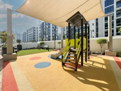 a playground with a slide in a building at Sleek Studio in Azizi Riviera Modern and Cozy Stay in Dubai