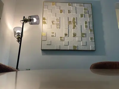 a table with a lamp and a map on the wall at Ultra Luxury Chic 2Bed in Dubai in Dubai