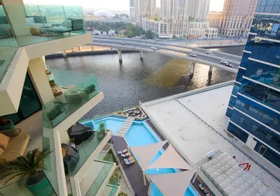 a view of a river from a building at Luxury 2BR Apartment in Urban Oasis by Missoni in Dubai