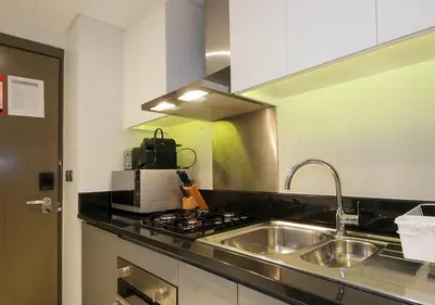 a kitchen with a sink and a stove at Breathtaking Views Studio Apartment in Damac Prive in Dubai