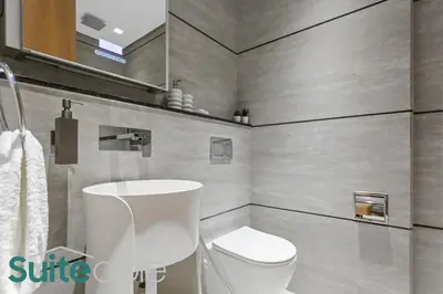 a bathroom with a toilet and a sink at Aesthetic Studio with Stunning Pool View in JVC in Dubai